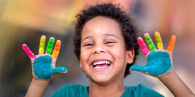 Boy with painted hands