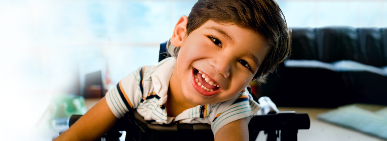 Foster chid smiling at camera