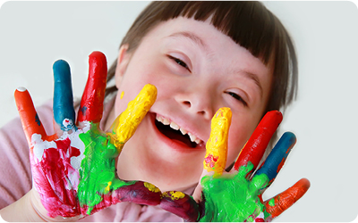 Foster child with painted hands