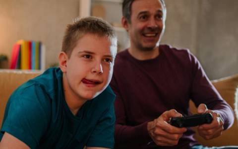 Boy and Dad gaming.